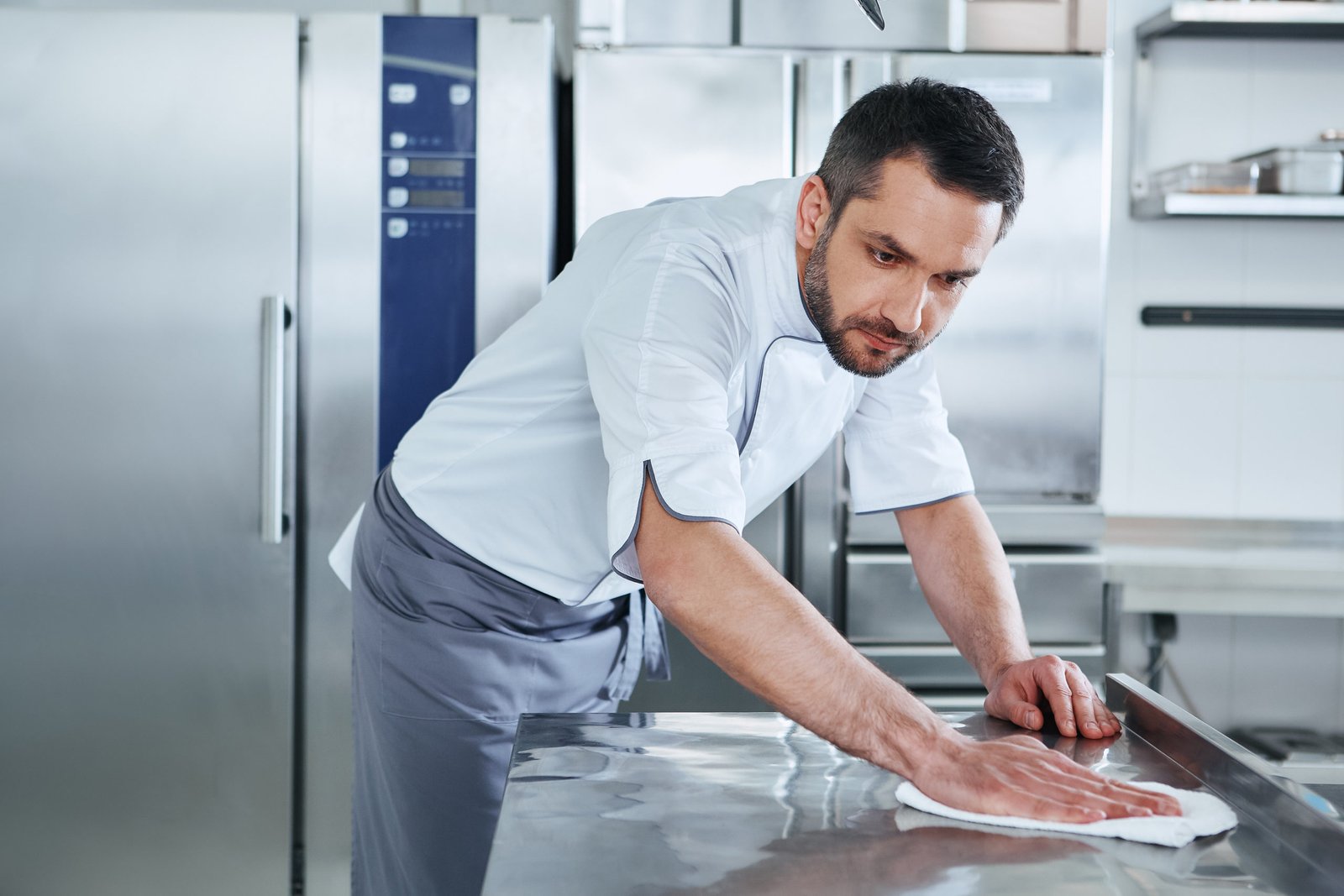 Man Cleaning Kitchen